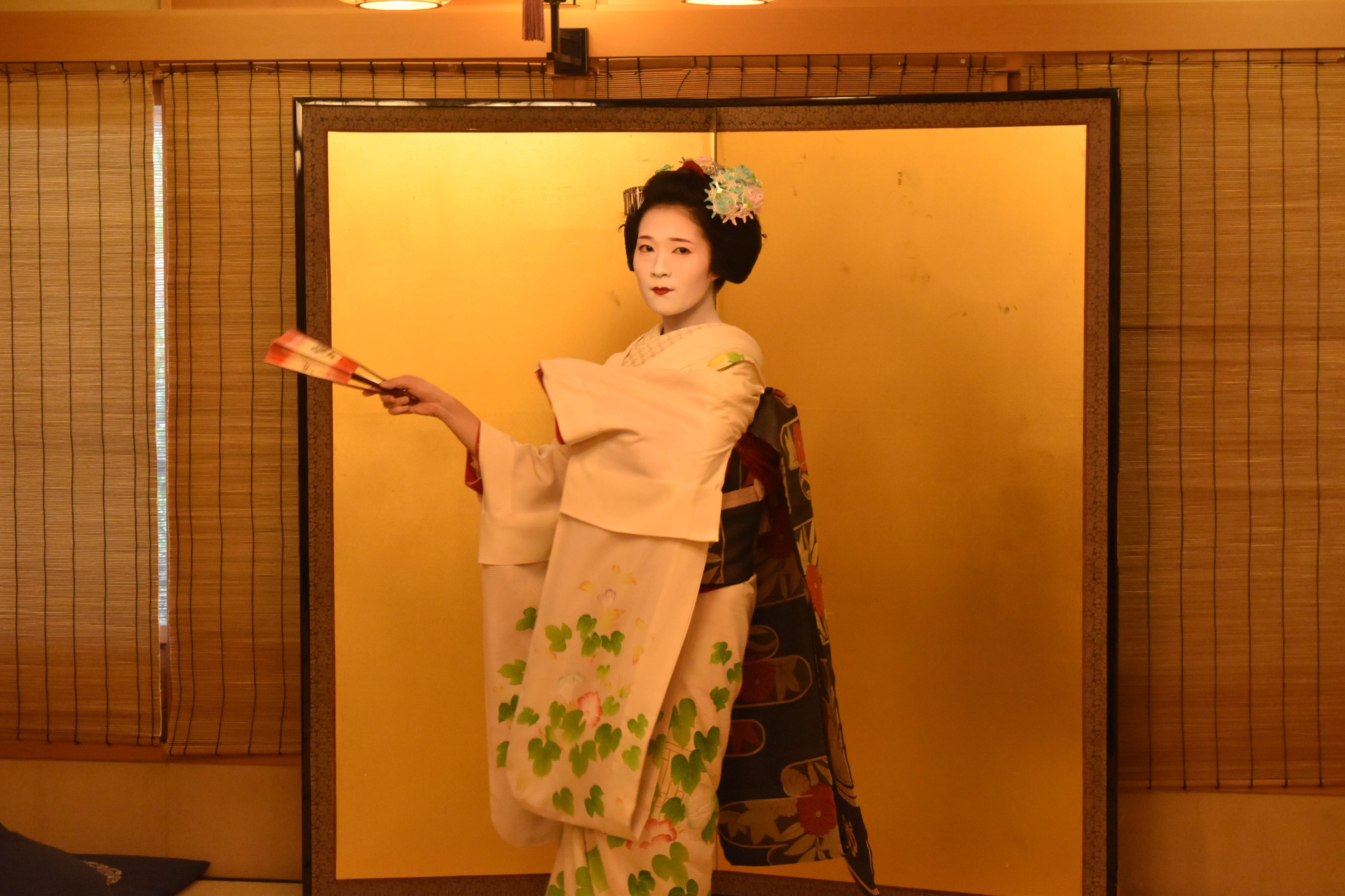 Elegant Geisha dance performance in Kyoto tatami room